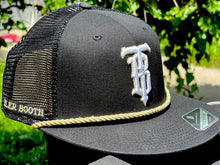 Load image into Gallery viewer, Black &amp; Gold Tyler Booth Trucker Hat
